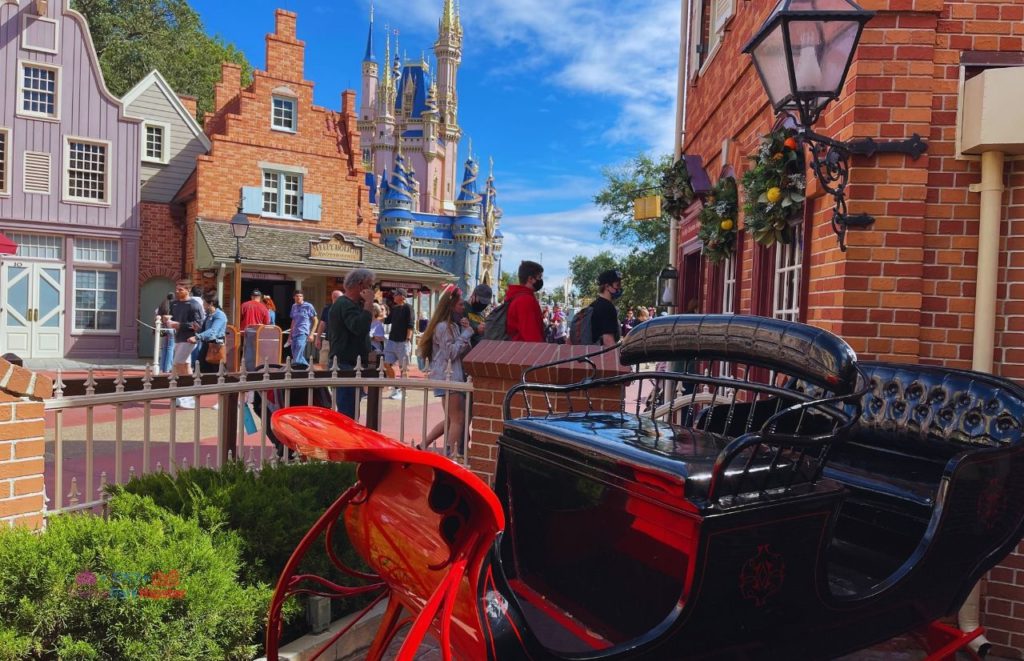 Ye Olde Christmas Shop in the Magic Kingdom Santa Sleigh at the entrance. Keep reading to get the best things to do at the 2023 Magic Kingdom for Christmas and a full guide to Mickey's Very Merry Christmas Party Tips!