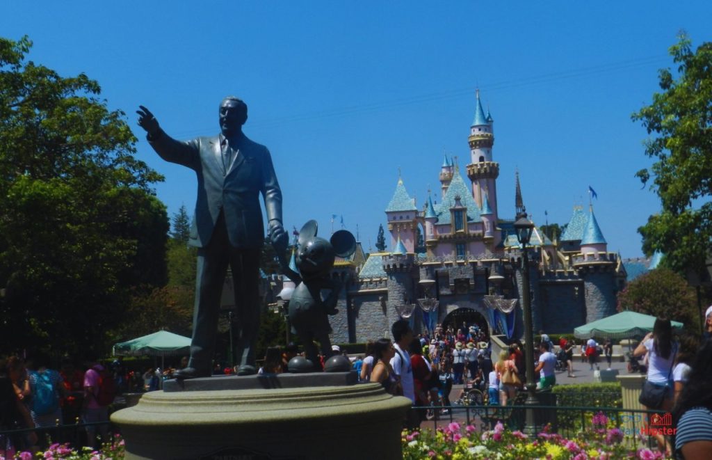 Disneyland Castle with Partners Statue of Mickey Mouse and Walt Disney