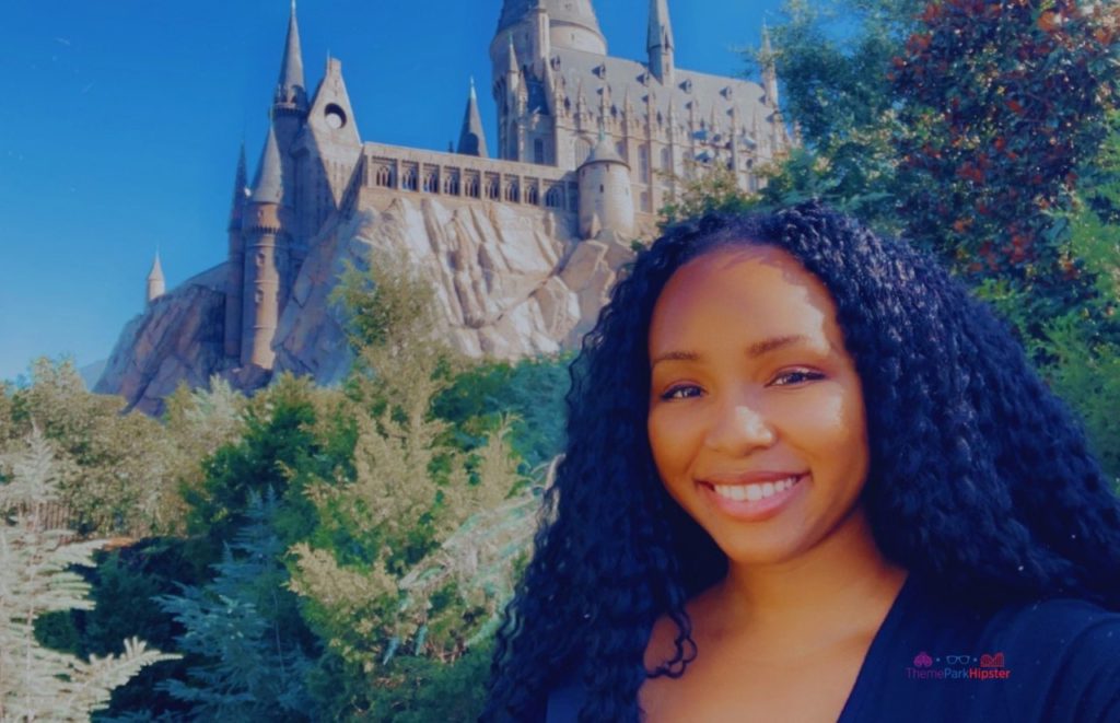 NikkyJ in front of Hogwarts Castle Forbidden Journey Harry Potter Ride. Keep reading to get the best Universal's Islands of Adventure photos!