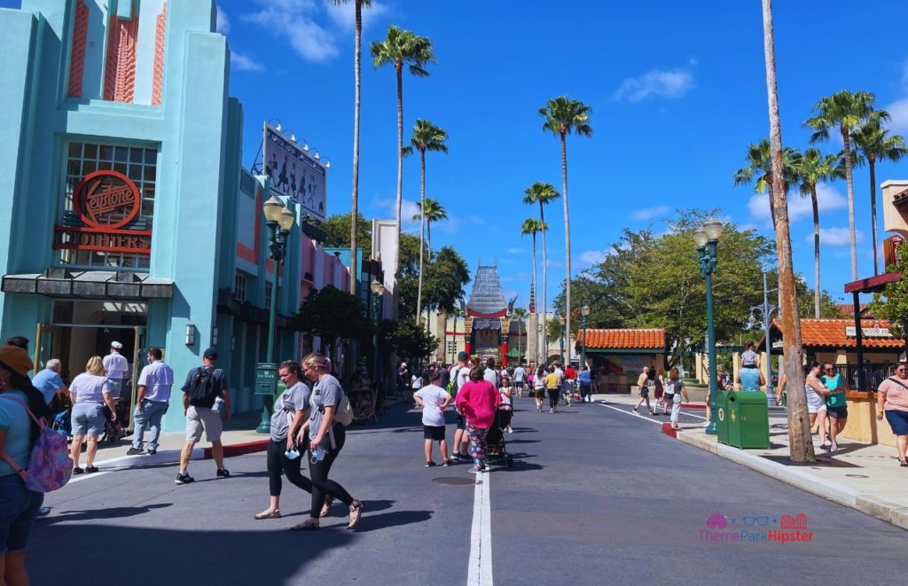 Entering Disney Hollywood Studios looking at Chinese Theater. Keep reading to know what to pack and what to wear to Disney World in July for your packing list.