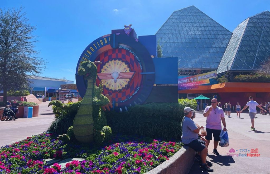 Epcot Flower and Garden Festival Figment Topiary. Keep reading to get the Best EPCOT Genie Plus Rides  and Lightning Lane.
