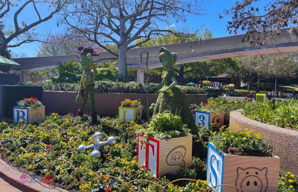 Epcot Flower and Garden Festival Toy Story Topiary with Woody and Bo Peep. Keep reading to see the best epcot flower and garden topiaries through the years!