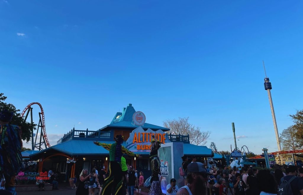 SeaWorld Orlando wait times with Altitude Burgers with Skytower in the evening. Keep reading to know the best days to go to SeaWorld and how to use the SeaWorld Orlando Crowd Calendar 2024.