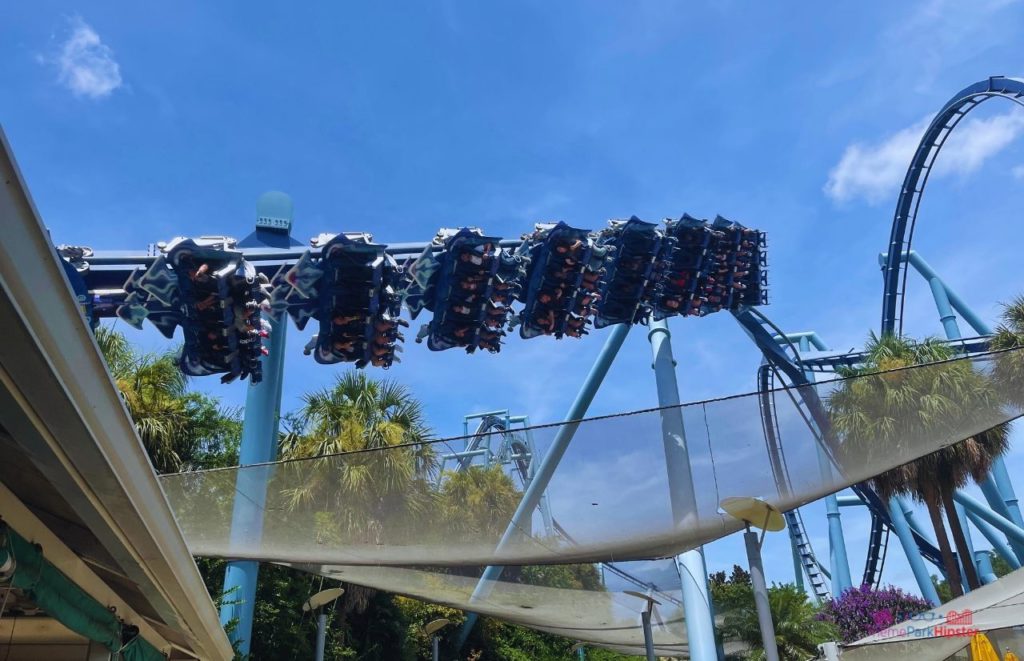 SeaWorld Orlando Wait Times with Manta Rollercoaster flying over in the sky. Keep reading to know the best days to go to SeaWorld and how to use the SeaWorld Orlando Crowd Calendar.