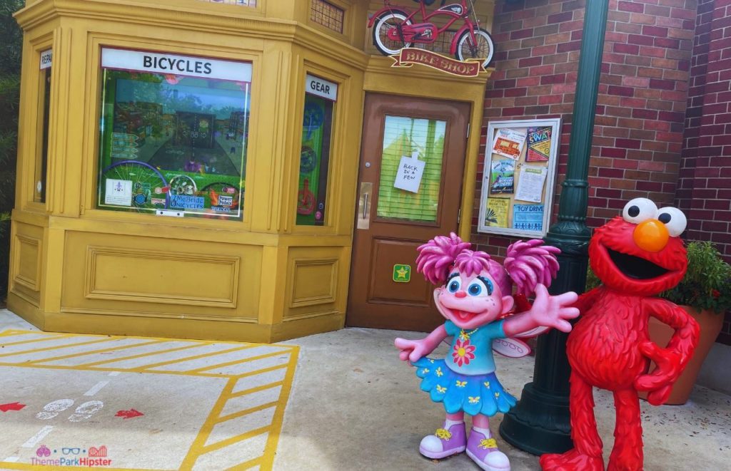 SeaWorld Orlando Resort Solo Trip Sesame Street Land Elmo and Abby Statues. Keep reading to learn how to have a Solo Trip to SeaWorld and how to travel alone with anxiety.