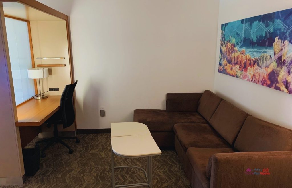 Springhill Suites Hotel Near SeaWorld Orlando King Suite sitting area. Keep reading to learn about the best cheap hotels near SeaWorld Orlando.