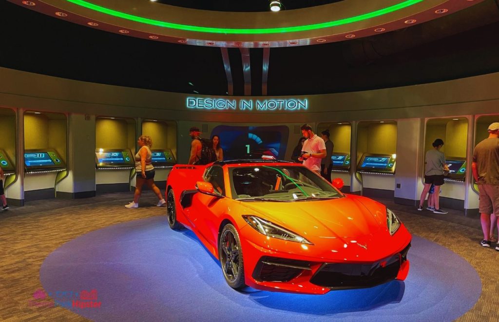 Test Track Epcot Design Motion area with Red Corvette. Keep reading to learn how to make money travel blogging and how Disney bloggers make money.