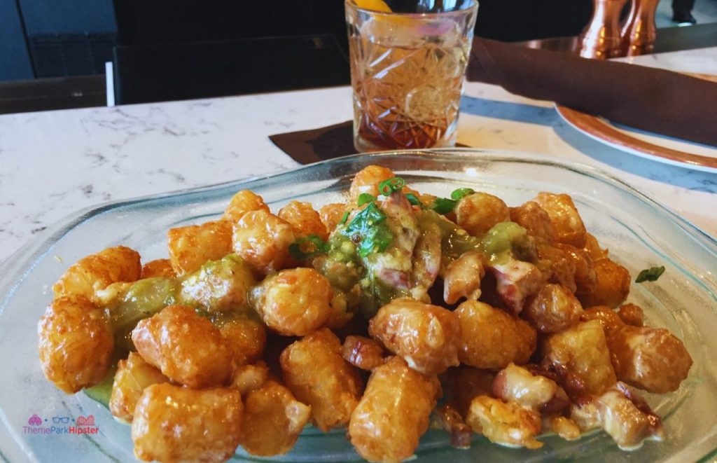 Toothsome Chocolate Emporium Loaded Tater Tots next to Manhattan. One of the best restaurants in Universal Orlando CityWalk.