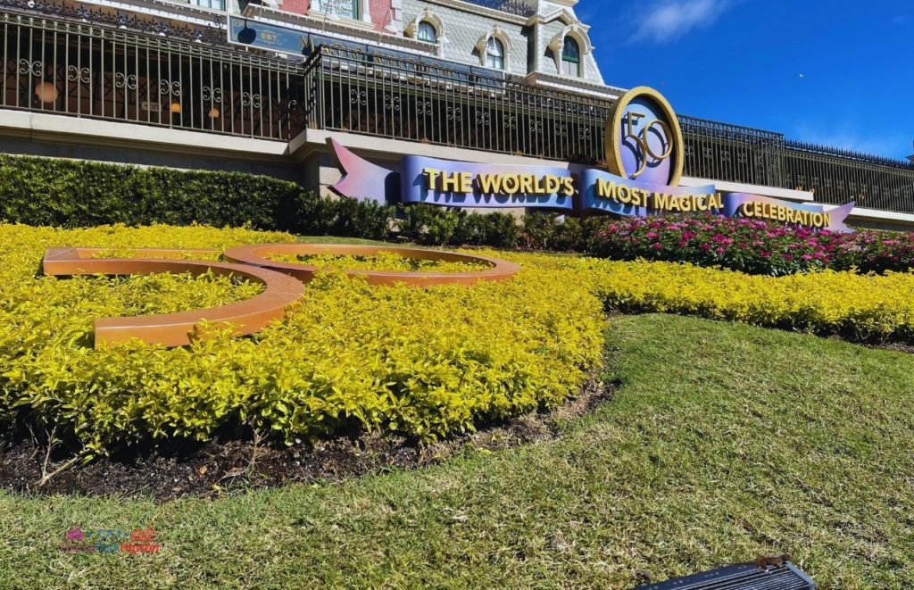 Disney Magic Kingdom Train station overlooking 50th Anniversary Sign. Continue reading to learn how to celebrate Disney World 4th of July!