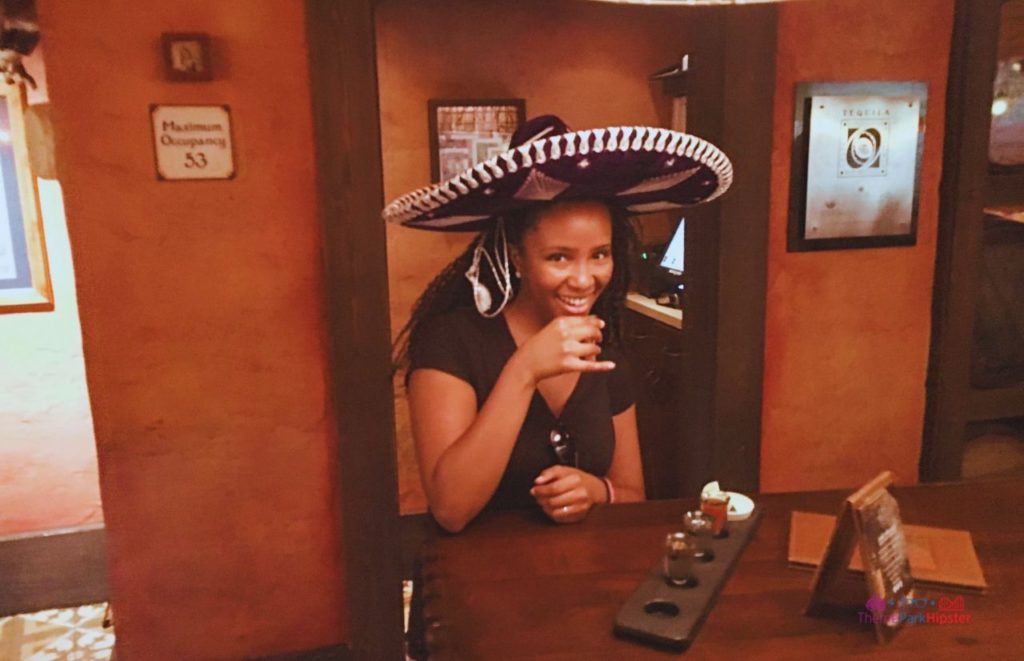 NikkyJ enjoying tequila in Epcot at La Cava Del Tequila. Keep reading to get the best things to do at Epcot Food and Wine Festival.