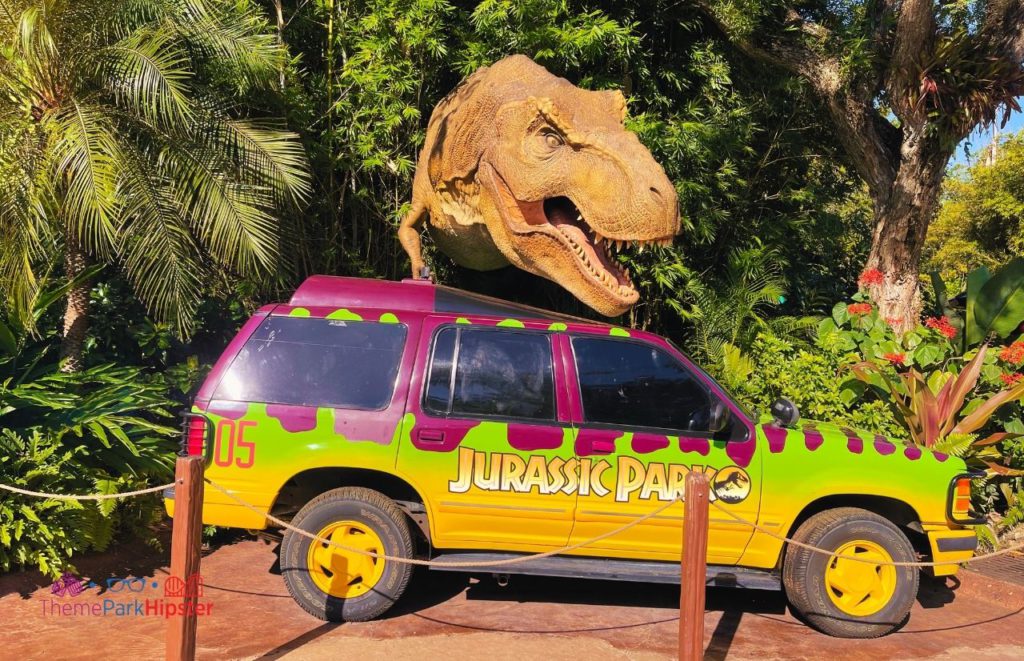 Universal Islands of Adventure Jurassic Park Jeep with T Rex Dinosaur coming out of the bushes one of the Best Rides and Attractions at Islands of Adventure for Solo Travelers.