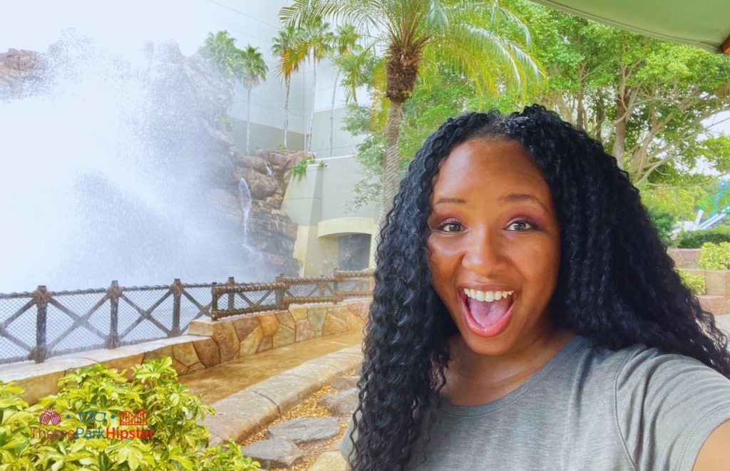 Universal Islands of Adventure NikkyJ in front of Jurassic Park River Adventure Splash one of the Best Rides and Attractions at Islands of Adventure for Solo Travelers.