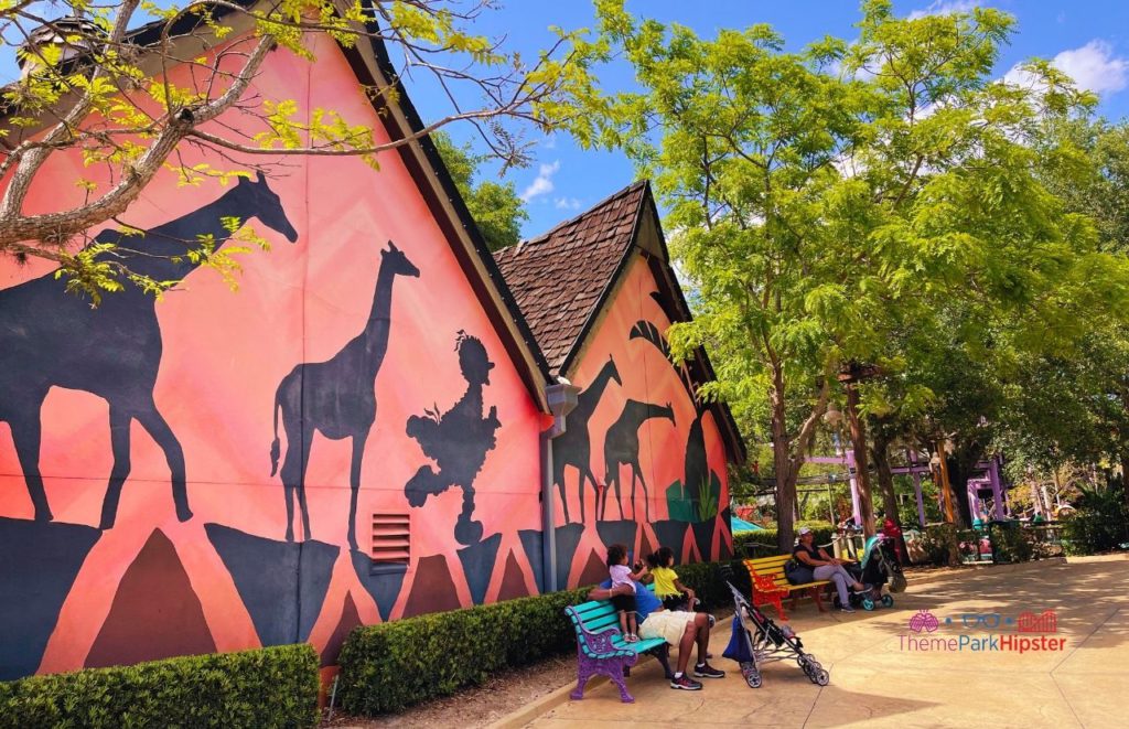 Busch Gardens Tampa Bay Animal mural in Sesame Street Land with giraffes and big bird on the side of the building. Keep reading to find out more about the Busch Gardens Tampa animals. 