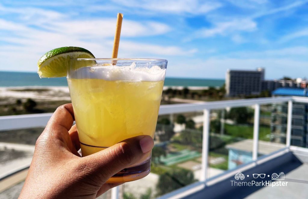 Treasure Island, Florida Ocean Club Hotel with me holding a Spicy Margarita. One of the best beaches near Disney World