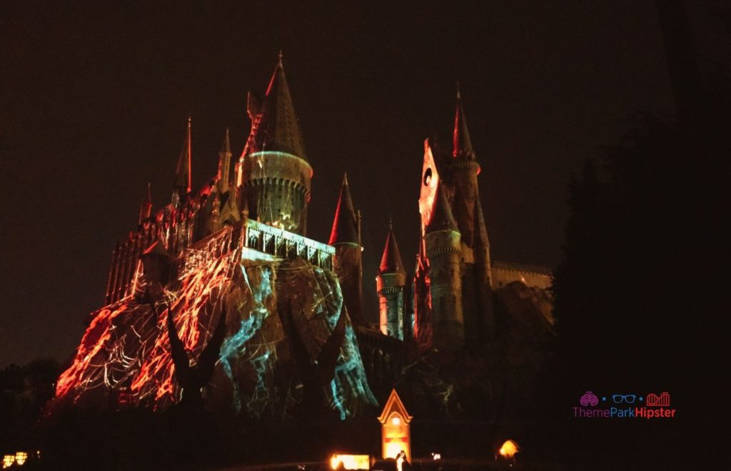 Universal Orlando Resort Hogwarts Castle Nighttime Show Dark Arts in Wizarding World of Harry Potter Hogsmeade Islands of Adventure