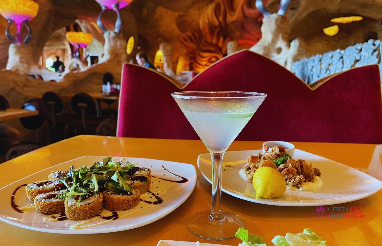 Universal Orlando Resort Mythos Restaurant at Islands of Adventure Calamari with Tempura Sushi and Cucumber Martini. Which is better Universal Studios vs Islands of Adventure? Keep reading to find out.
