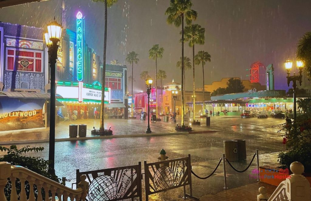 Universal Orlando Resort Rainy night in front of Horror Make Up Show and Mels Drive In at Universal Studios Florida. Keep reading to know what to pack for an amusement park and have the best theme park packing list.