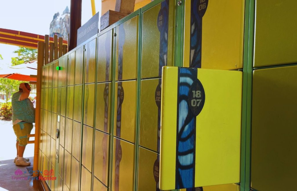 Multiple rows of yellow lockers with tropical print at Universal Orlando Resort Volcano Bay.