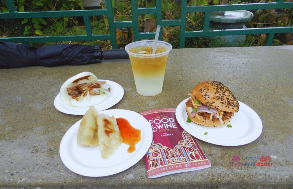 Epcot Food and Wine Festival China Booth Food Dumplings Beef Bao Buns and cocktails. Keep reading to get the best things to do at Epcot Food and Wine Festival.
