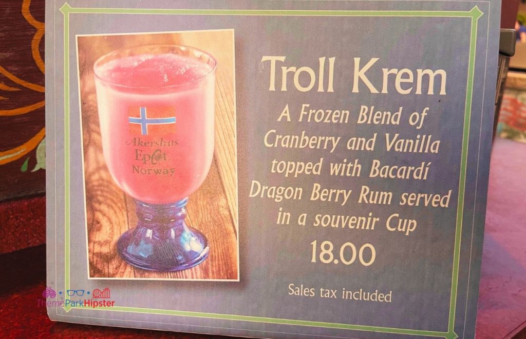 Epcot Food and Wine Festival Norway Troll Krem Cocktail with cranberry vanilla topped with bacardi dragon berry rum. One of the best places to stop on your epcot bar crawl.