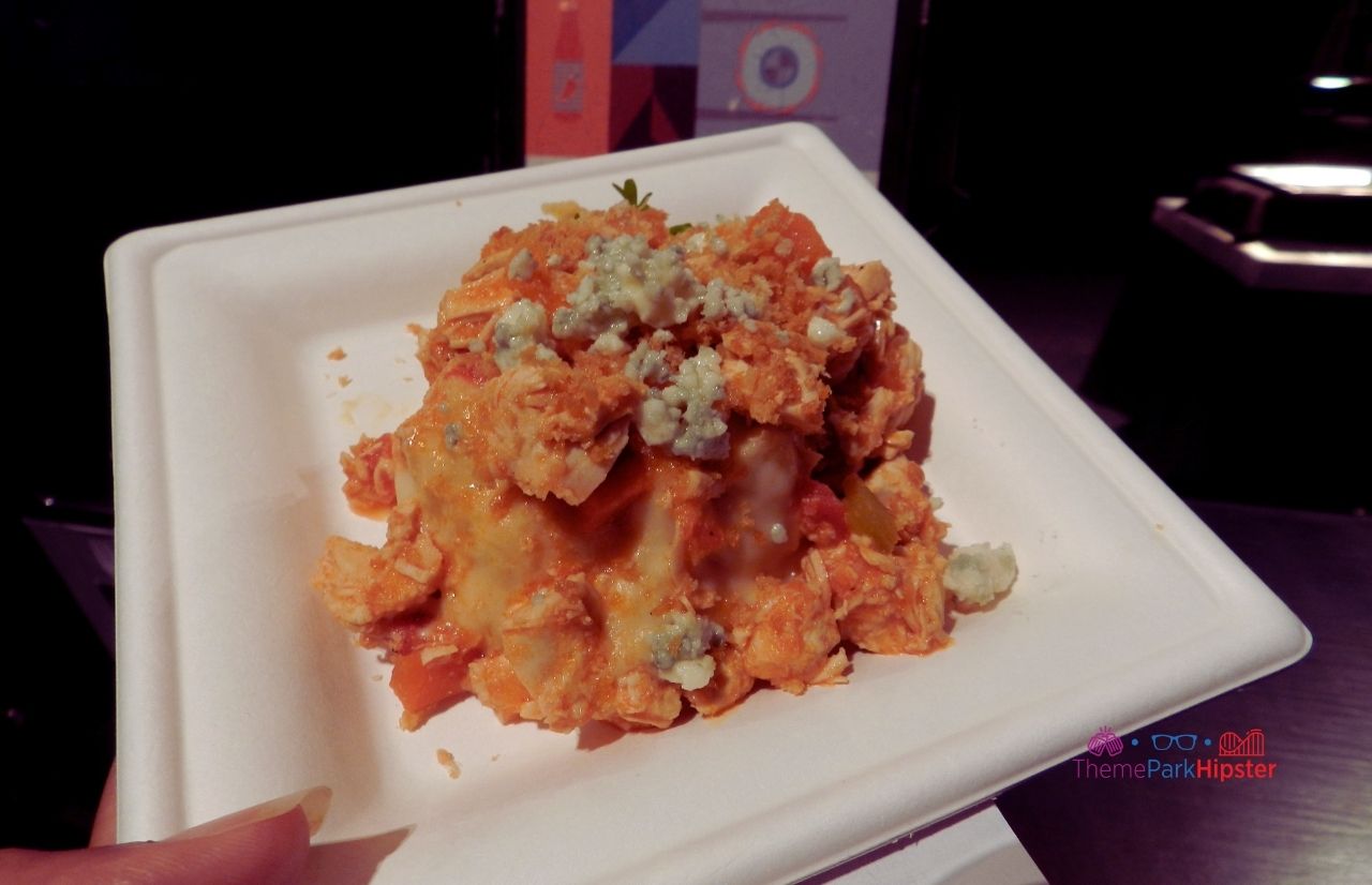 Epcot Food and Wine Festival loaded buffalo Mac and Cheese booth from World Showplace. Keep reading to get the best things to do at Epcot Food and Wine Festival.