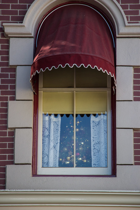 A small Christmas tree in the window of Walt's apartment at the Disneyland Fire Dept.