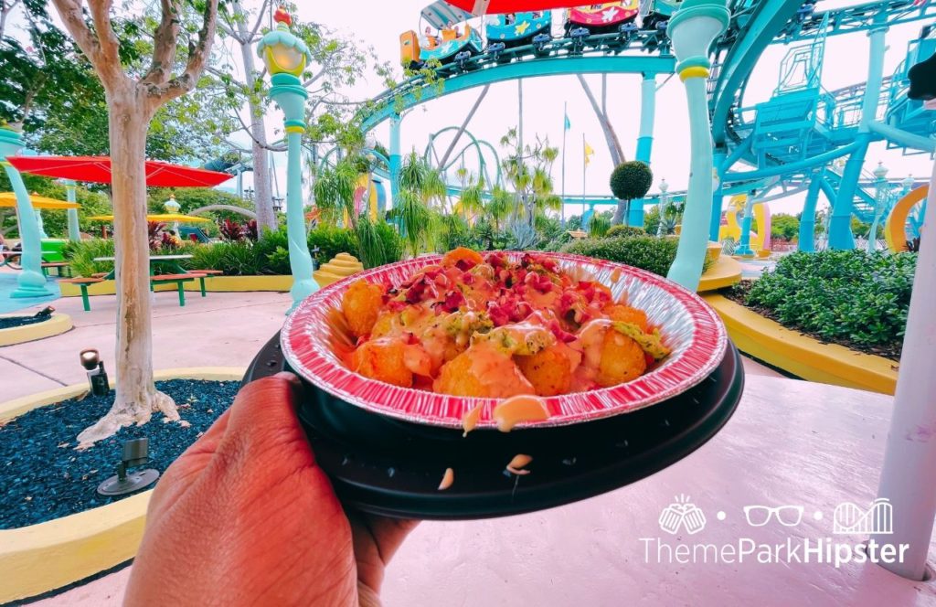 Green Eggs and Ham Stand Tots in Seuss Landing Universal Orlando Resort Islands of Adventure. Keep reading to get the 5 Cheapest, Best Food at Islands of Adventure UNDER $10.