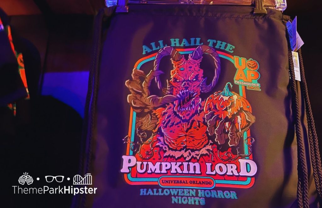Pumpkin Patch with Pumpkin King annual passholder bag from Tribute Store Merchandise at HHN 31 Halloween Horror Nights 2022 Universal Orlando. Keep reading to see what to wear to Halloween Horror Nights.