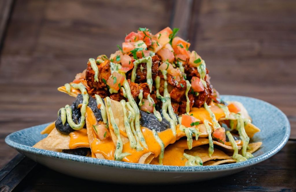 Ghost Pepper Nachos Lamplight Lounge Boardwalk Dining Halloween at Disneyland and Disney California Adventure Oogie Boogie Bash Party. Keep reading to get the best restaurants at Disneyland for adults.