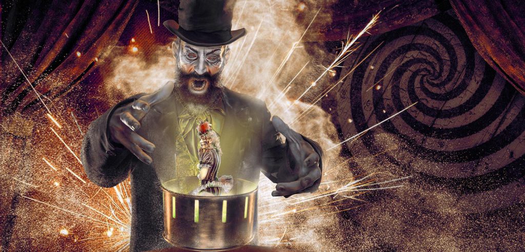 Mesmer Haunted House at Knott's Scary Farm with animated photo of a sinister hypnotist and small burlesque sideshow character a  within an illuminated open object. Keep reading to hear more about Knott’s Scary Farm haunted houses.