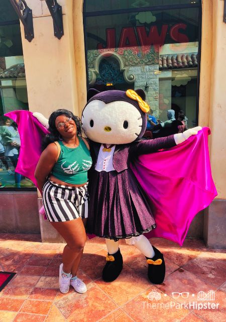 Victoria Wade meeting Hello Kitty Character at Universal Studios Hollywood Halloween Horror Nights. Keep reading to see why I love being a solo traveler and traveling to theme parks alone.