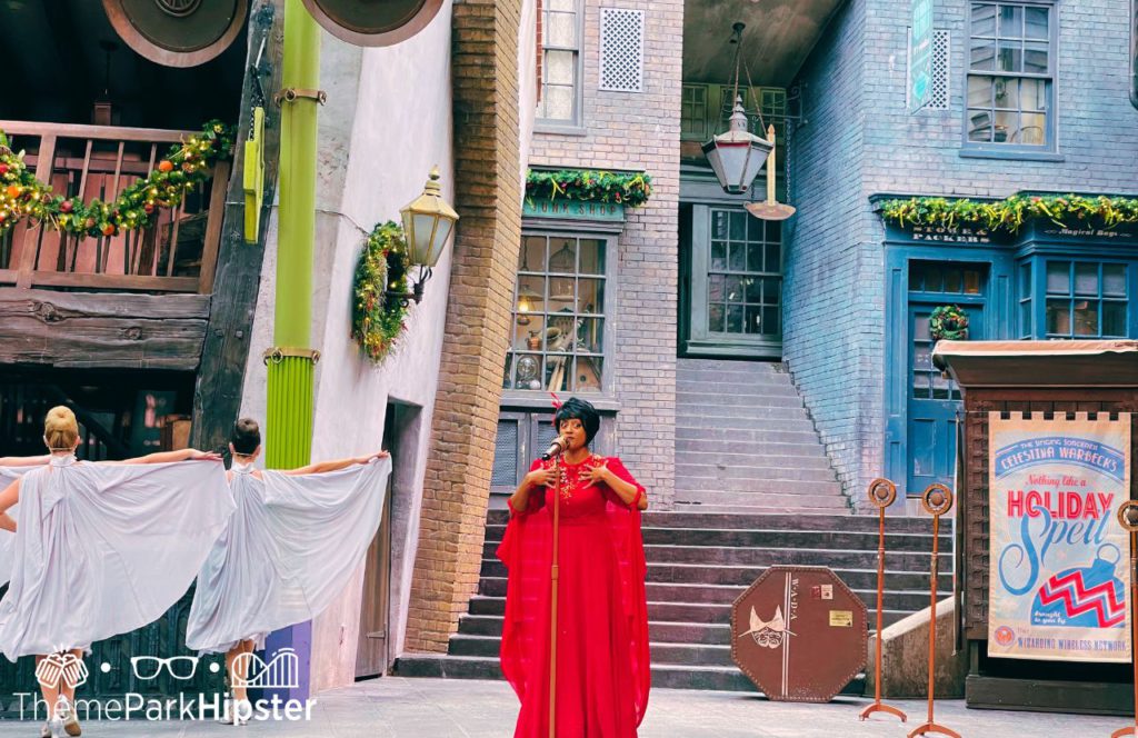 Celestina Warbeck and her banshees sing holiday songs in Diagon Alley for 2023 Christmas at Wizarding World of Harry Potter