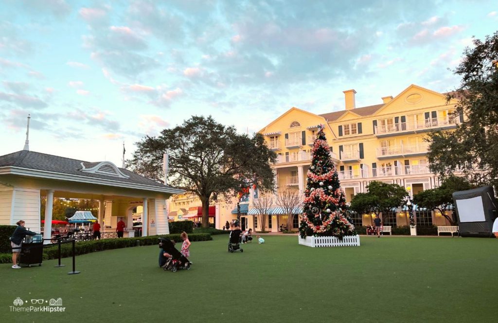 Christmas at Disney Boardwalk Inn and Villas Christmas Tree on Green Lawn. Keep reading to know what to pack and what to wear to Disney 
World in December for your packing list.