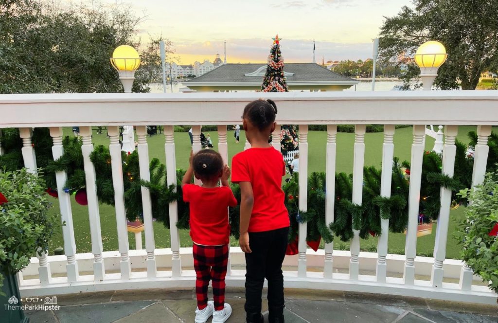 Christmas at Disney Boardwalk Inn and Villas two black girls looking at Christmas Tree
