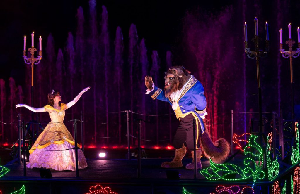 Belle and Beast float across the water as the air fills with love and romance when Fantasmic! at Disney's Hollywood Studios. Keep reading to know what to pack and what to wear to Disney World in June for your packing list.