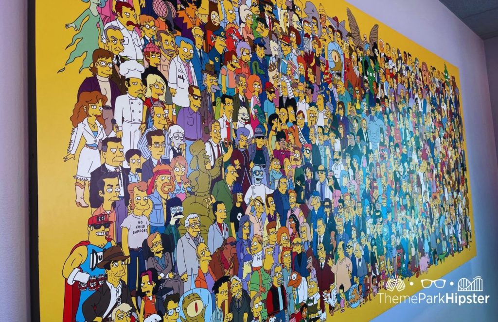 Universal Orlando Resort Simpsons Mural at Universal Studios. Keep reading for the full guide to the BIG Pink Donut from Universal Lard Lad.