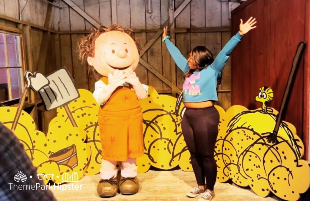 Knott's Berry Farm in California Peanuts Celebration Pigspen Pig's Pen character meet and greet with Victoria Wade. Keep reading to see why I love being a solo traveler and traveling to theme parks alone.
