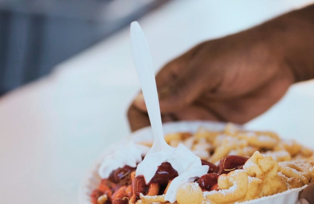 Knott's Berry Farm in California Whip Cream Powered Sugar and Berries on top of Funnel Cake. Keep reading to get Knott’s PEANUTS Celebration Guide: Food, Characters, Shows and more!