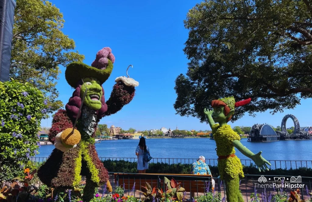 Epcot Flower and Garden Festival 2023 Captain Hook and Peter Pan Topiary in the UK Pavilion. Keep reading to get the Best EPCOT Genie Plus Rides and Lightning Lane.