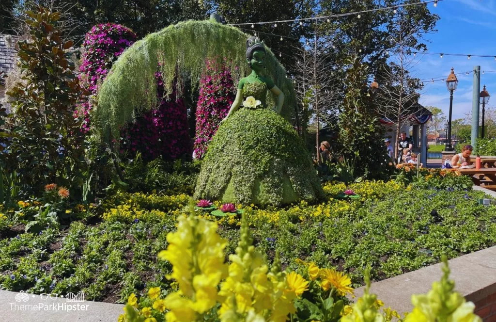 Epcot Flower and Garden Festival 2023 Princess Tiana Topiary in the American Pavilion one of the best things to do at Disney World in the Summer!