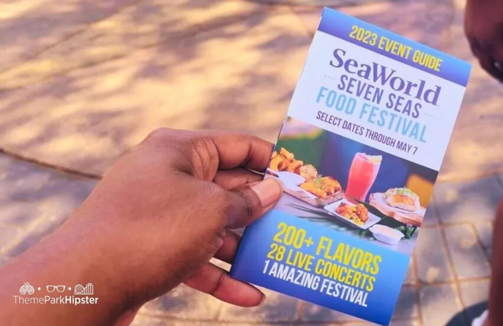 SeaWorld Orlando Resort Seven Seas Food Festival Event Guide Passport. Keep reading to learn how to have a Solo Trip to SeaWorld and how to travel alone with anxiety.