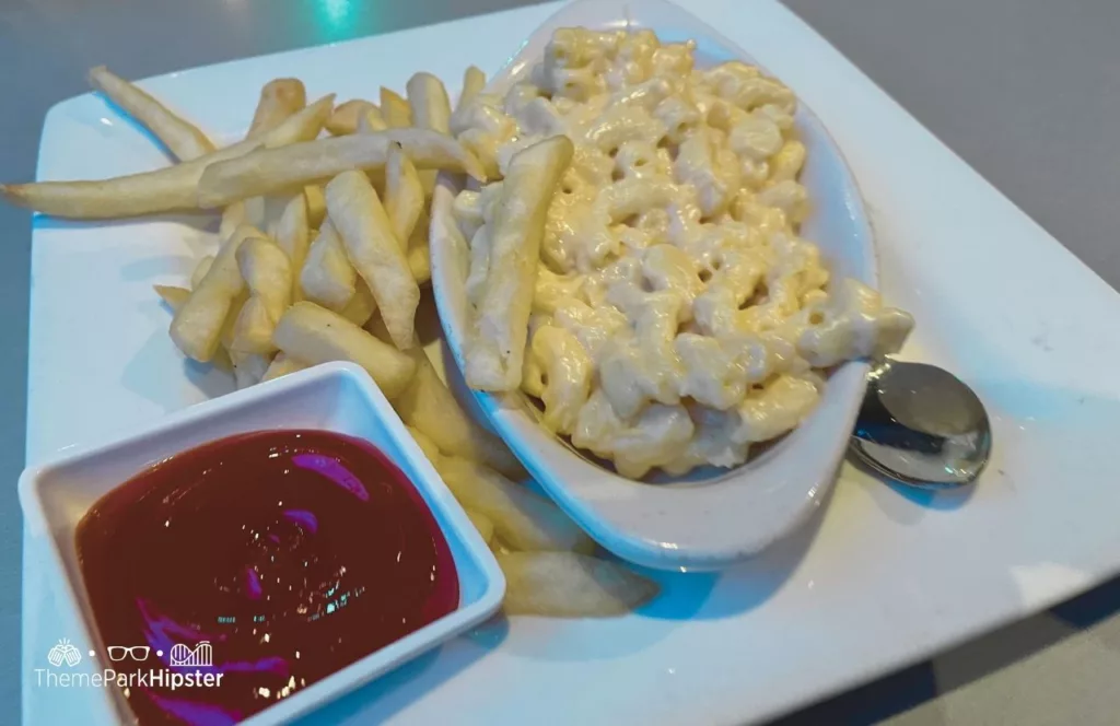SeaWorld Orlando Resort Sharks Underwater Grill with a plate of mac and cheese with fries. Keep reading to find out more about Sharks Underwater Grill at SeaWorld Orlando.