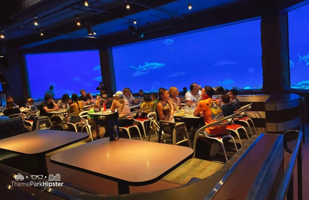 SeaWorld Orlando Resort Sharks Underwater Grill dining area. Keep reading to learn how to have a Solo Trip to SeaWorld and how to travel alone with anxiety.