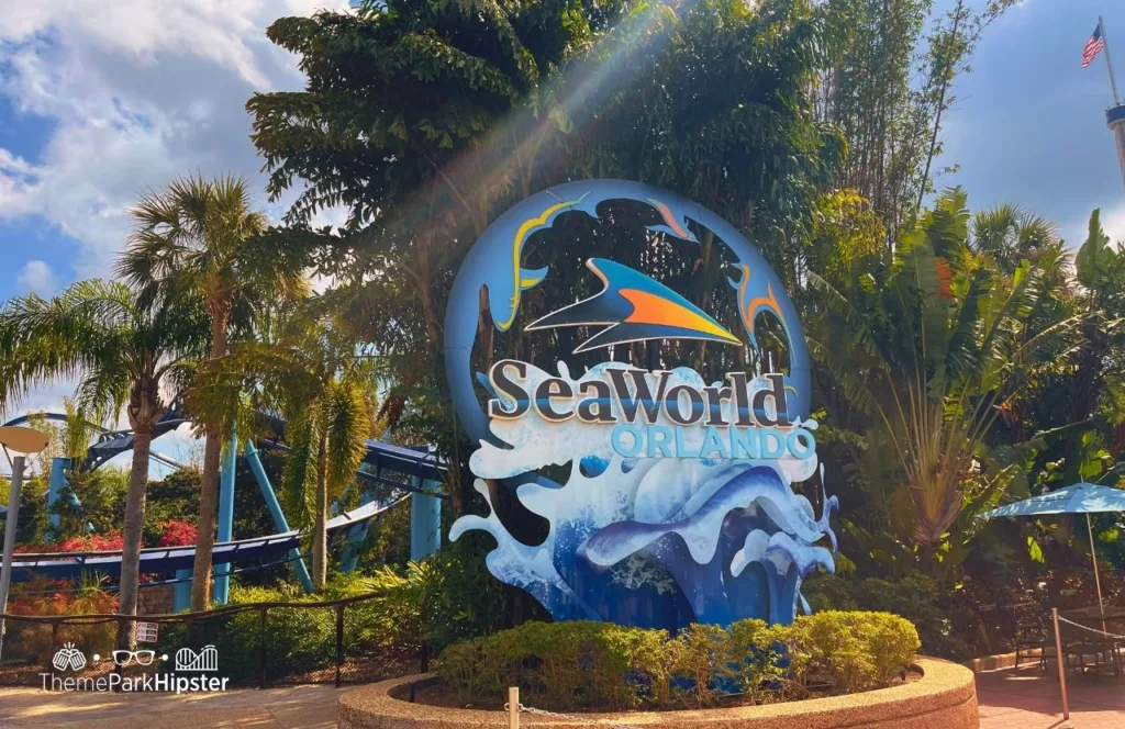 SeaWorld Orlando Resort logo sign next to Manta Roller Coaster. Keep reading to discover more about Sharks Underwater Grill at SeaWorld Orlando.