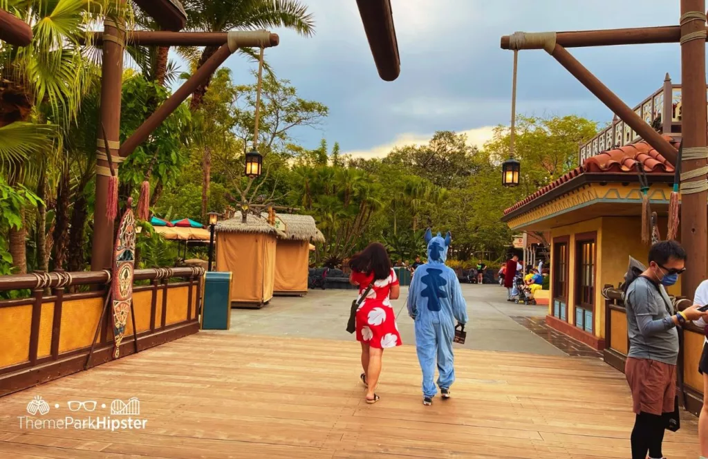 Mickey's Not So Scary Halloween Party at Disney's Magic Kingdom Theme Park Entering Adventureland with people dressed like Lilo and Stitch Costumes. Keep reading to know what to pack and what to wear to Disney World in August for your packing list.