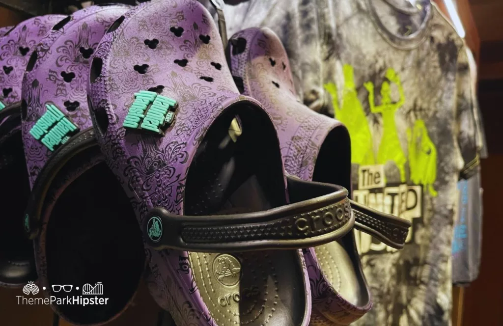 Mickey's Not So Scary Halloween Party at Disney's Magic Kingdom Theme Park Haunted Mansion Merchandise in Memento Mori Store Croc Shoes and Shirts. Keep reading to know what to pack and what to wear to Disney World in August for your packing list.