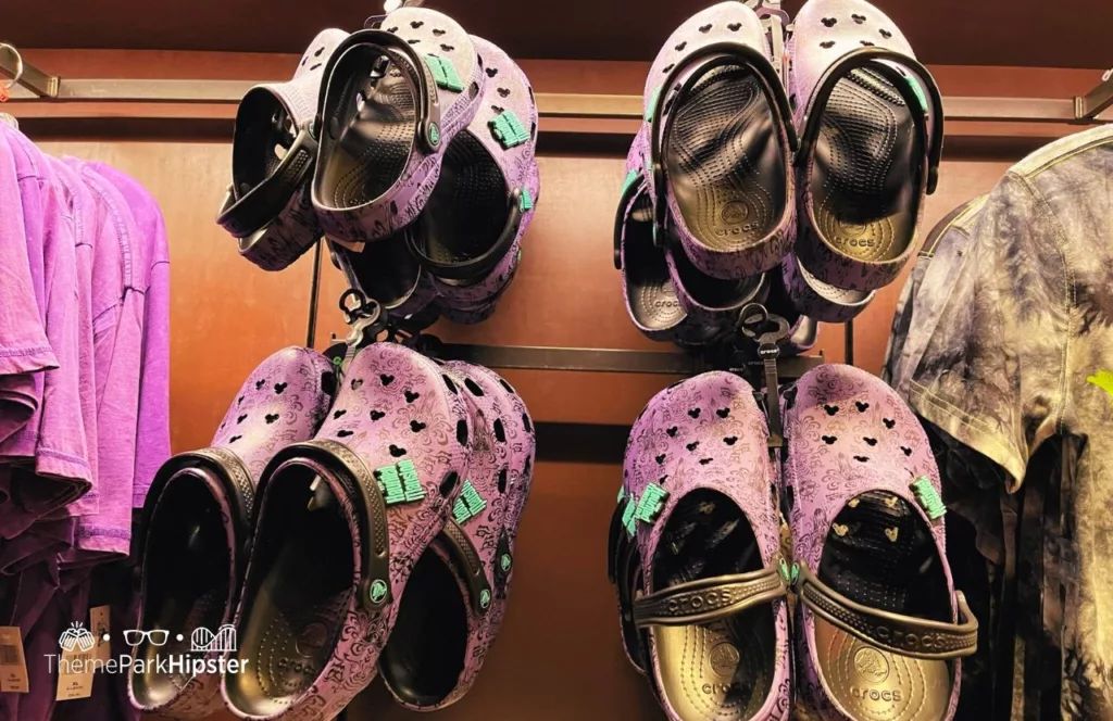 Disney Theme Park Haunted Mansion Merchandise in Memento Mori Store Crocs Shoes. Keep reading to know what to pack and wear to Disneyland in April for the perfect spring outfit.