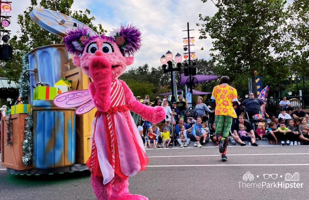 SeaWorld Orlando Resort Christmas Celebration Sesame Street Land Christmas Parade. Keep reading to learn how to have a Solo Trip to SeaWorld and how to travel alone with anxiety.