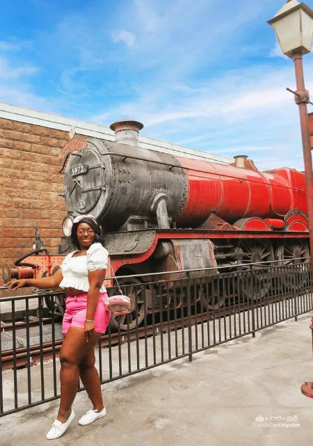 Best Spots for Wizarding World of Harry Potter Photos with Victoria Wade in front of Hogwarts Express. Keep reading to get the best Harry Potter secrets at Universal Studios.