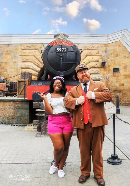 Best Spots for Wizarding World of Harry Potter Photos with Victoria Wade in front of Hogwarts Express with Conductor at Universal Orlando Islands of Adventure.